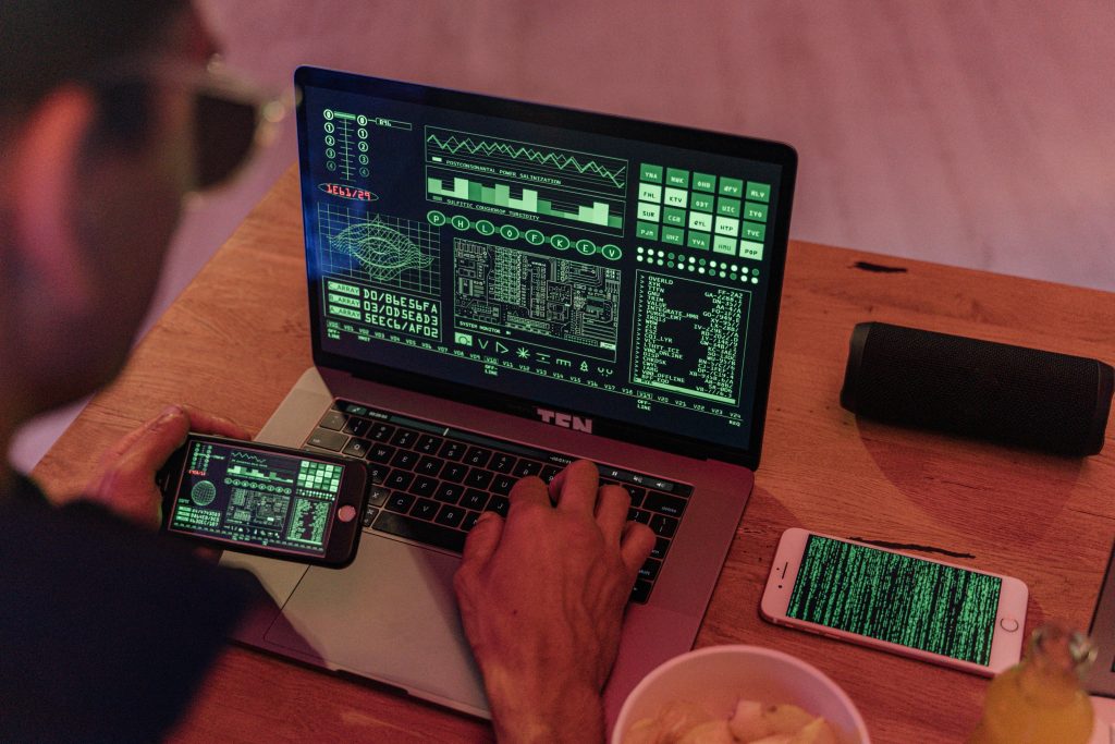Employee using unauthorized cloud app on a tablet connected to corporate network, illustrating shadow IT risk.